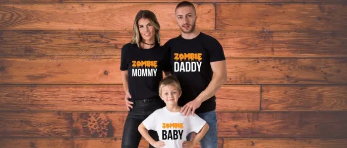 family photo with parents wearing dumb mommy and dumb daddy shirts. affordable costumes ideas for families