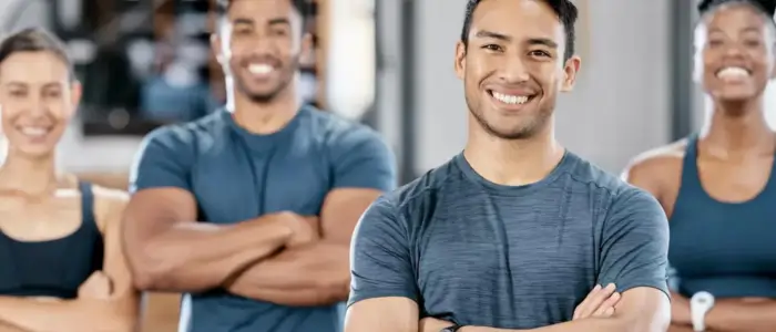 people in a gym wearing custom shirts for workout