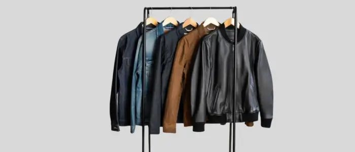 a collection of perfect bomber jackets displayed on a metal stand