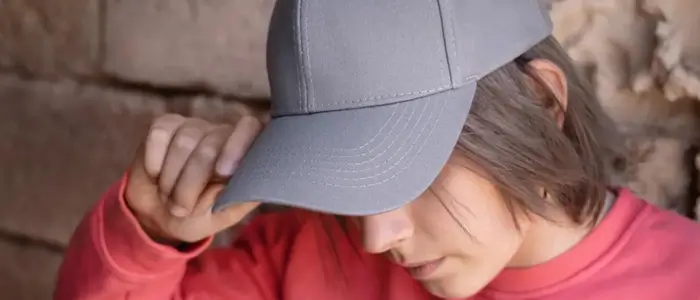 a woman wearing a gray hat