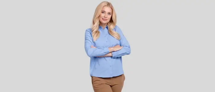  woman wearing blue port authority ls608 shirt and brown pants