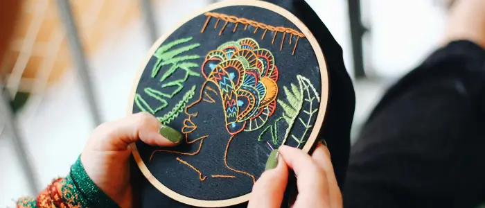 worker doing embroidery