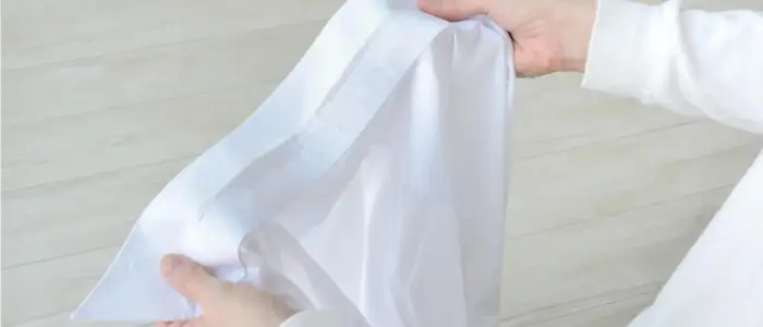 a person holding a classy white work shirt