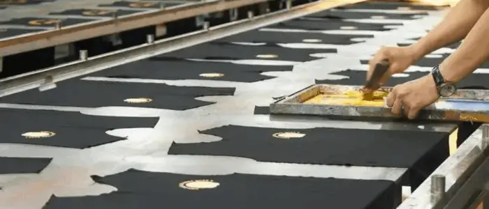 worker doing screen printing