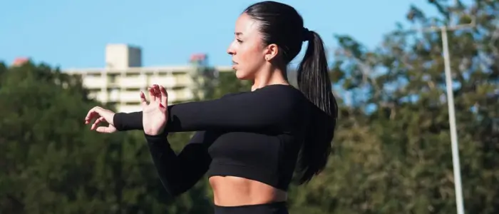 woman in black athletic crop top 