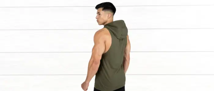 gym guy wearing an olive green hooded tank top