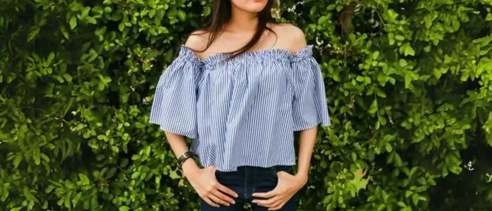 lady in off-shoulder blue top and jeans