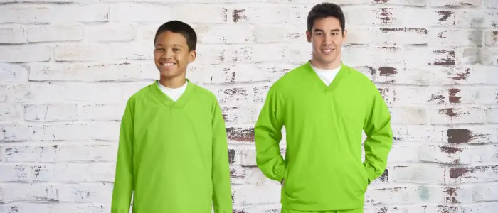 a man and boy in matching green woven t-shirts