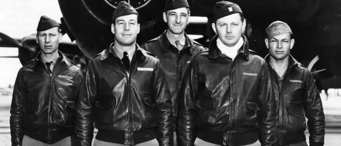 a group of men in bomber jackets