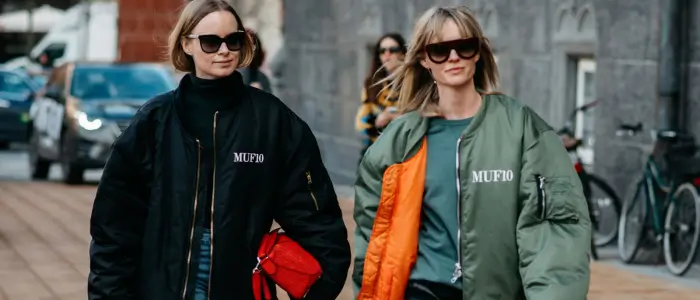 two woman in a bomber jacket