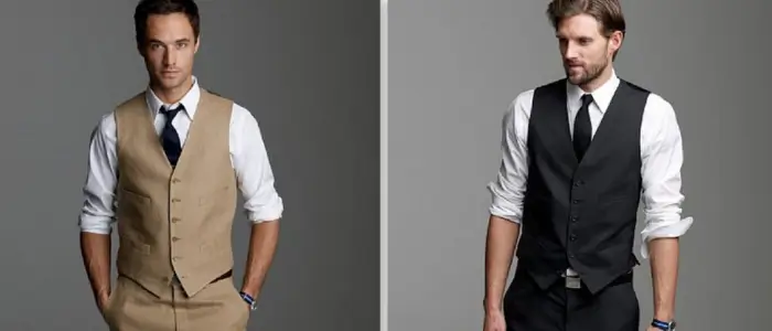 two men wearing formal vests